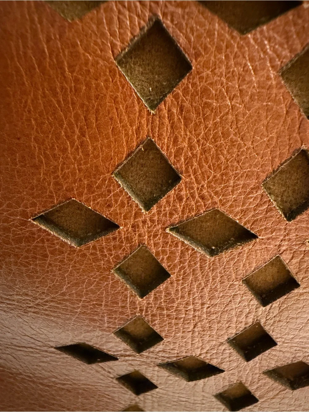 Patricia Nash brown/cognac tote with geometric laser cut pattern.